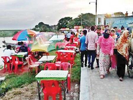 People visiting a recreation centre beside Padma.	photo: Observer 