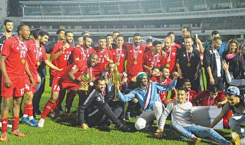 Champions Palestine boys celebrating with the trophy of the fifth Bangabandhu Gold Cup on Friday at the Bangabandhu National Stadium in Dhaka. 	photo: Observer