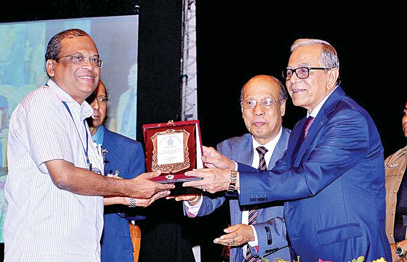 Prof Dr ABM Abdullah receives UGC (University Grants Commission) award 2013 from President Abdul Hamid.