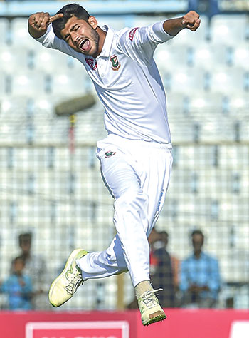 Bangladesh cricketer Nayeem Hasan celebrates after the dismissal of the West Indies cricketer Kemar Roach during the second day of the first Test cricket match between Bangladesh and West Indies at the Zahur Ahmed Chowdhury Stadium in Chittagong on Friday. 	photo: AFP 