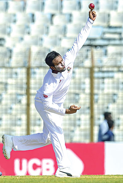 Bangladesh cricket captain Shakib Al Hasan delivers a ball during the second day of the first Test cricket match between Bangladesh and West Indies at the Zahur Ahmed Chowdhury Stadium in Chittagong on Saturday.	photo: AFP 