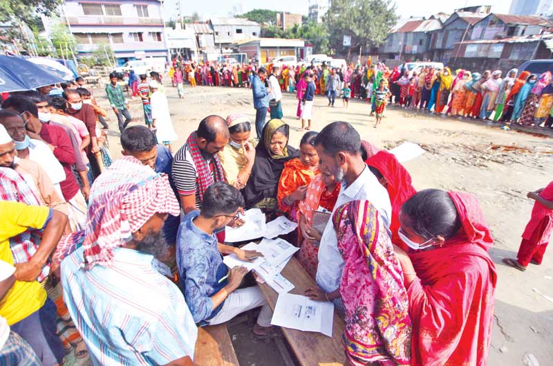 People get on the spot registration for Covid-19 vaccine at Karail Bosti, a large shantytown in the capital, as the Health Directorate has undertaken a massive inoculation  programme for the slum dwellers in the city. 
