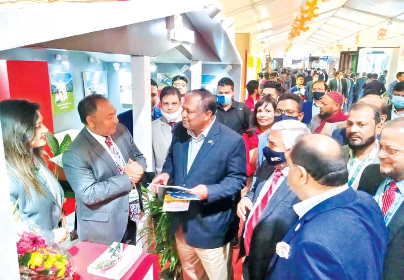 Commerce Minister Tipu Munshi going around the fair venue after inaugurating a five-day fair of Real Estate and Housing Association of Bangladesh (Rehab) at Bangabandhu International Conference Centre in the capital on Thursday.    photo : Observer 