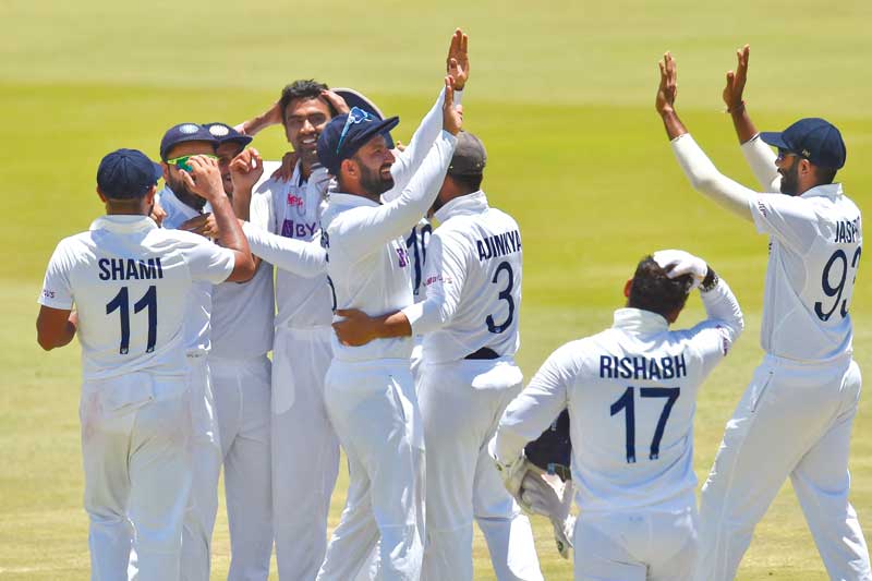 India players celebrate after winning the first Test cricket match between South Africa and India at SuperSport Park in Centurion on December 30, 2021.	photo: AFP 