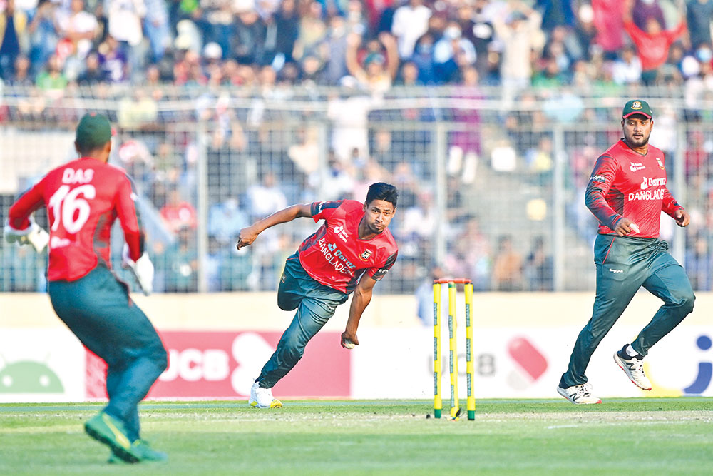 Bangladesh's Mustafizur Rahman (C) fields the ball during the first Twenty20 international cricket match between Bangladesh and Afghanistan at the Sher-e-Bangla National Cricket Stadium in Dhaka on March 3. 	PHOTO: AFP