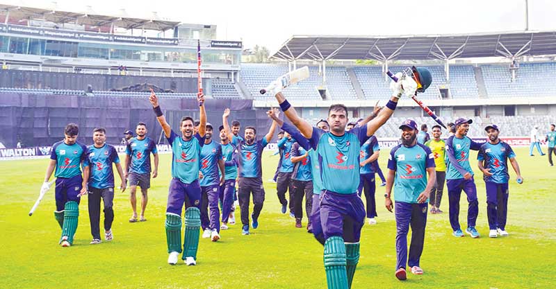 Sheikh Jamal Dhanmondi Club players are seen to leaving the ground on Tuesday after securing the title of Bangabandhu Dhaka Premier Division Cricket League 2021-22.	photo: BCB