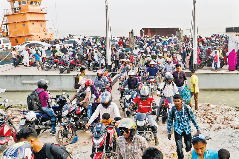 Noticeably the number of motorcyclists are more than ever before among those who are returning to Dhaka to join work after Eid holidays. The picture was taken from Shimulia Ferry Ghat on Friday.	PHOTO: OBSERVER