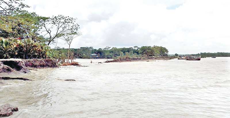 A vast tract of land submerged in Patuakhali due to incessant rainfall and 2 to 3 feet of tidal water that breached the embankment in recent days. The photo was taken from Kalapara on Monday.    photo : Observer