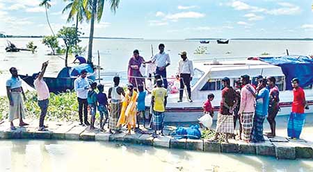 Dry food being distributed among the marooned people in Mathbaria Upazila of Pirojpur.	photo: observer