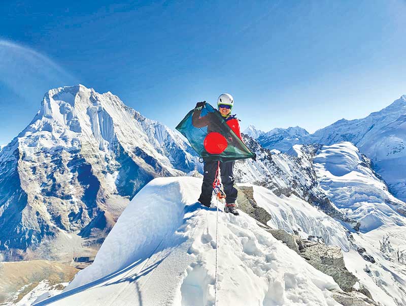 Mountaineer Shayla Bithi on top of Dolma Khang peak of the Himalayas.  	photo : Observer 