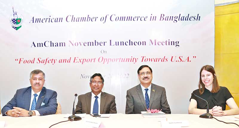 Agriculture Minister Dr. Abdur Razzaque (second from left) attend AmCham luncheon at a city hotel on Sunday.