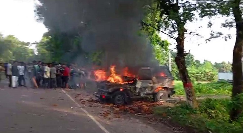 The enraged protesters setting fire to an Army vehicle in Gopalganj. Photo: Observer