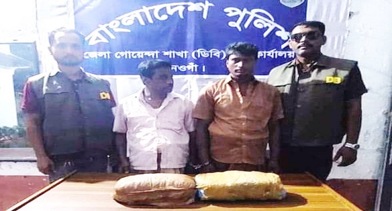 The arrested duo with the seized drugs. Photo: Observer