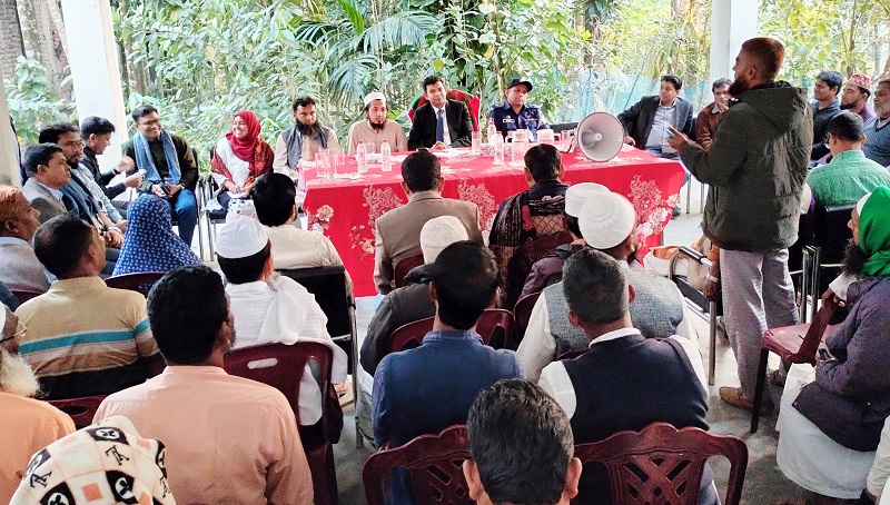 Government officials, including Lalmohan UNO Md. Shah Aziz, listen to local residents' concerns during the public hearing at Badarpur Union Parishad premises. Photo: Observer