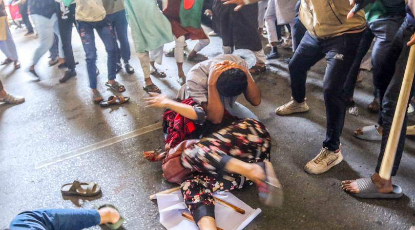 Two protesters fell down in the middle of the chaos and got beaten up. Photo: Sumit Ahmed