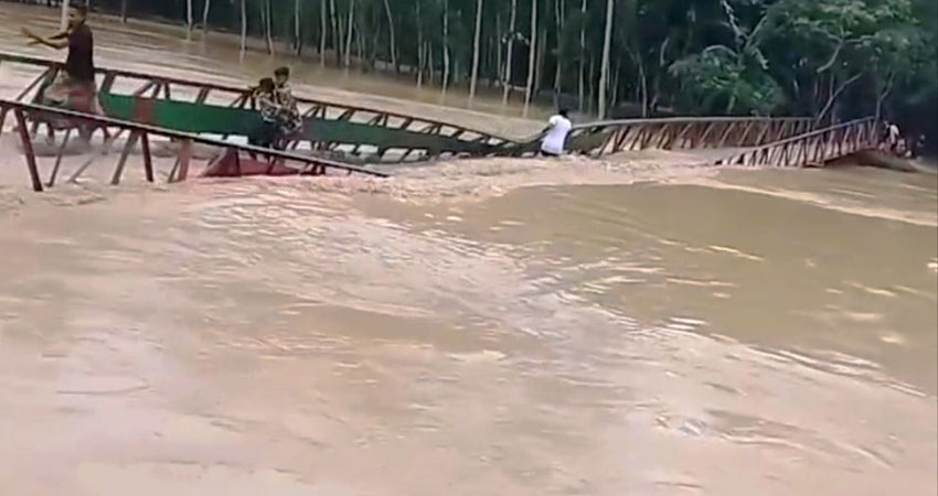 Four including child escape as flash flood sweeps away 50-metre bridge in Sherpur