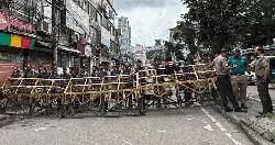 Police barricades the entrance of Alia Madrasa