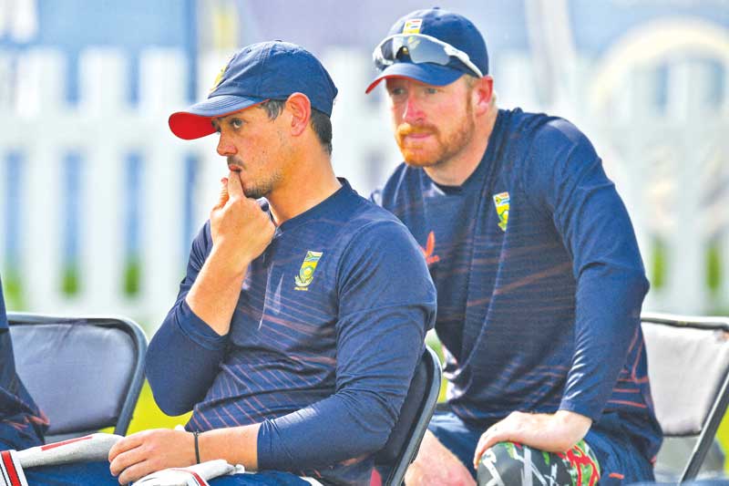 South Africa's Quinton De Kock (L) and his teammate Wiaan Mulder attend a practice session ahead of the ICC men's Twenty20 World Cup cricket match between South Africa and West Indies at the Sheikh Zayed Cricket Stadium in Abu Dhabi on October 25, 2021.	photo: AFP 