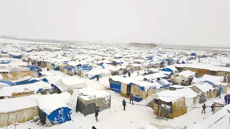 A snow covered displacement camp for Yazidi people is seen in the area of Dawudya