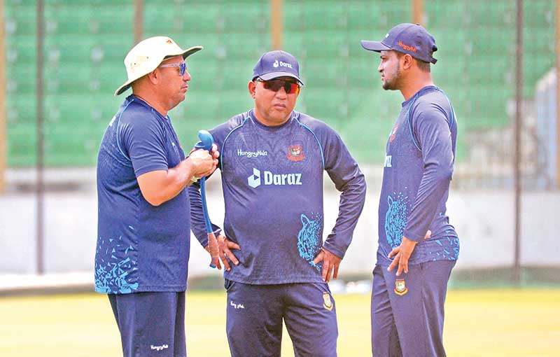 Bangladesh's cricket head coach Russell Domingo (L), team director Khaled Mahmud (C) and cricketer Shakib Al Hasan (R) talk during a practice session ahead of their first Test match against Sri Lanka at the Zahur Ahmed Chowdhury Stadium in Chittagong on May 14, 2022. 	photo: AFP 
