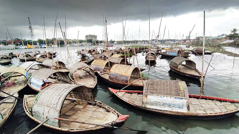 Boats remained anchored in the Shitalakshya River