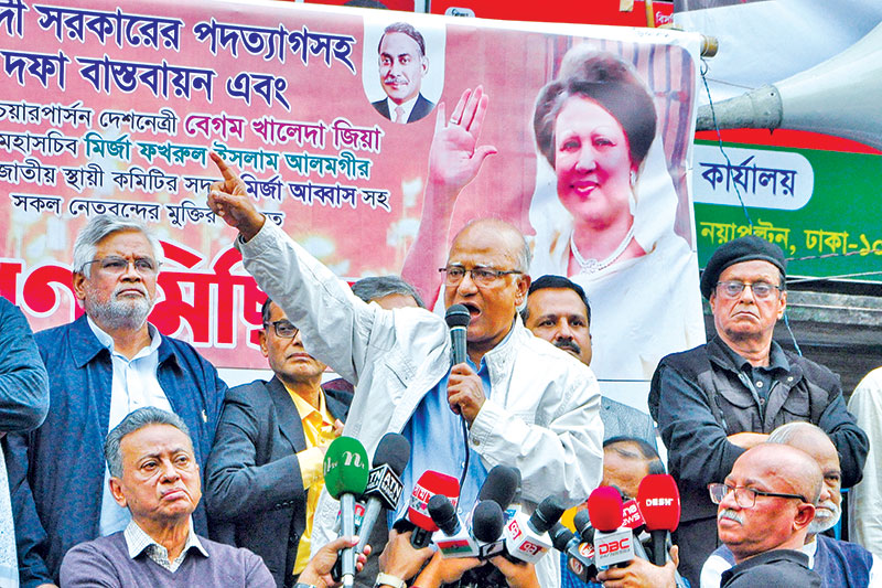 BNP activists in front of party central office moments before to start a procession on Friday. (Inset) BNP leader Khandaker Mosharraf Hossain addressing the rally. 	PHOTO: OBSERVER