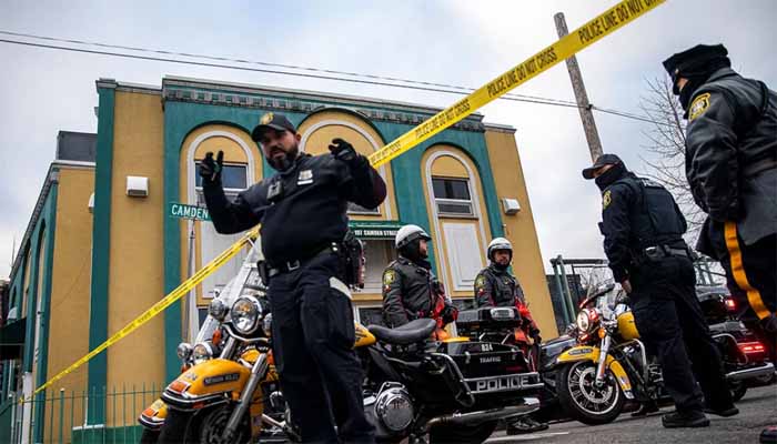 Newark Police Officers stand guard outside the mosque following the shooting of Imam Hassan Sharif in Newark, New Jersey on January 3, 2024. Photo: Reuters