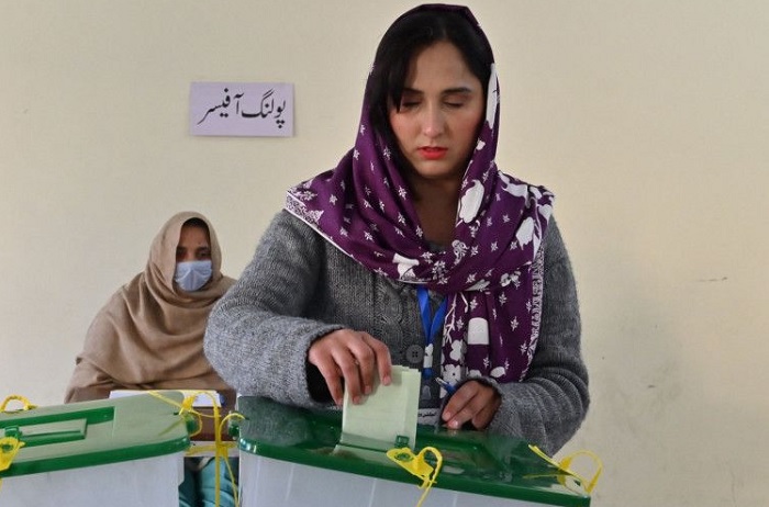 A woman casts her ballot at a polling station in Islamabad on February 8, 2024. PHOTO: AFP