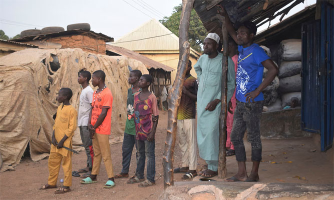 People gather around an area were gunmen kidnapped school children in Chikun, Nigeria. Photograph: AP Photo/AP