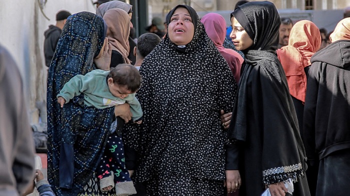 Palestinian women mourn their relatives killed in Israeli bombardment in front of the morgue of the Al-Shifa hospital in Gaza City on March 15, 2024 [Getty]