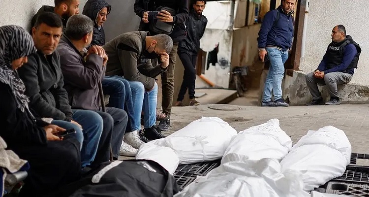 Mourners react next to the bodies of Palestinians killed in an Israeli strike, amid the ongoing conflict between Israel and Hamas, in Rafah, in the southern Gaza Strip, on March 24, 2024. (Reuters)