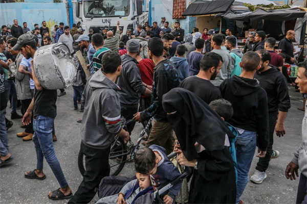 Armed teams of the Palestinian group Hamas secure UNRWA aid trucks at a school for displaced Palestinians in Rafah. Photo: dpa/File