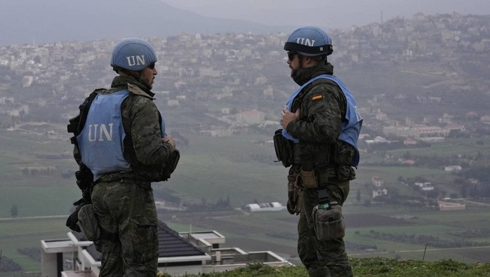 FILE - Spanish UN peacekeepers stand on a hill overlooking the Lebanese border villages with Israel in Marjayoun town on Wednesday, Jan. 10, 2024. (AP Photo/Hussein Malla, File) 