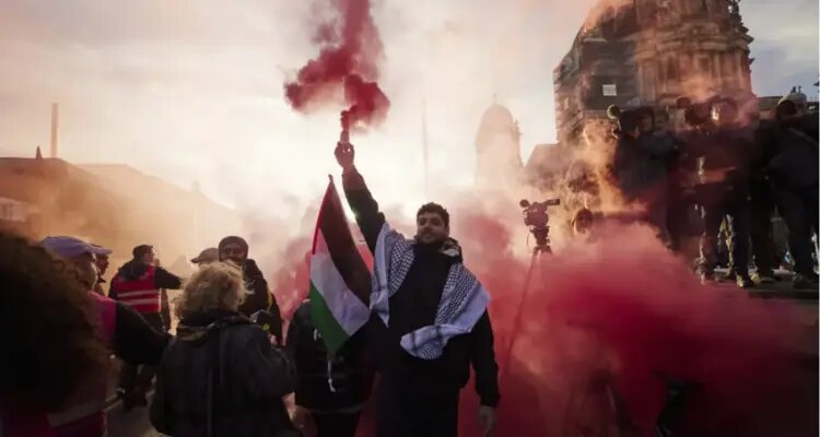 People gather to take part in a pro-Palestinian rally in Berlin, Germany on November 4, 2023. (Joerg Carstensen/dpa via AP)