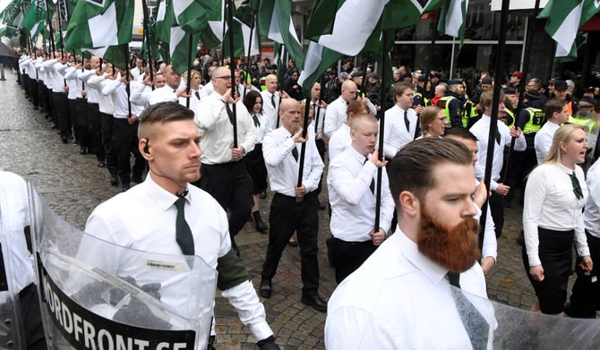 Members of the Neo-nazi Nordic Resistance Movement march through the town of Ludvika, Sweden May 1, 2018. (REUTERS)