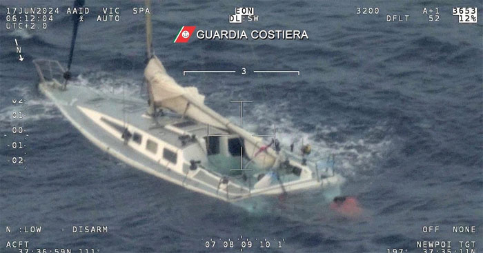 This picture taken early Monday, June 17, 2024 by the Italian Coast Guard shows a sail boat used by migrants half sank in the Mediterranean Sea between Italy and Greece early Monday, June 17, 2024. (Italian Coast Guard via AP, Ho)