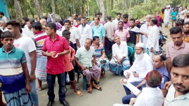 Villagers throng at former army personnel Mahbub's home at Char Bhadrasan under Shibchar upazila in madaripur district after hearing about the accident at Amtali in Barguna on Saturday afternoon