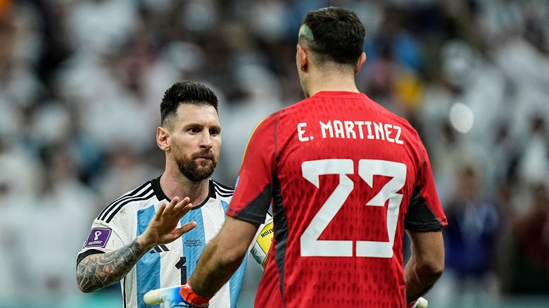 Argentina's Lionel Messi celebrates with Argentina's goalkeeper Emiliano Martinez at the end of the World Cup quarterfinal soccer match between the Netherlands and Argentina, at the Lusail Stadium in Lusail, Qatar, Saturday, Dec. 10, 2022