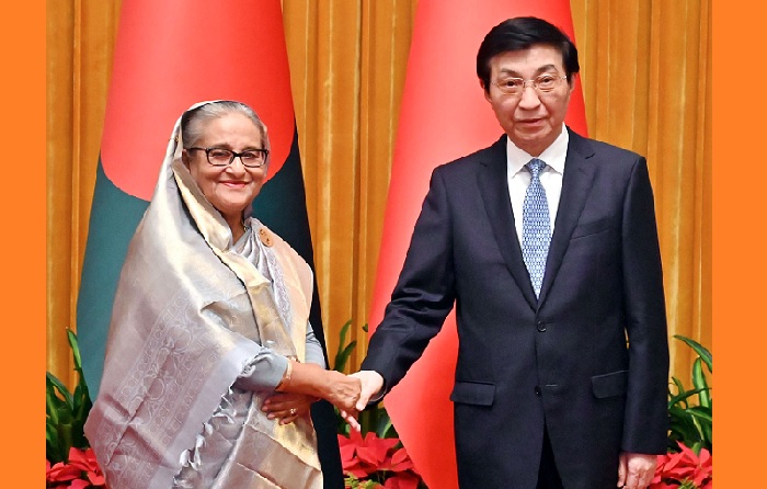 Prime Minister Sheikh Hasina exchanges plesantries with National Committee of The Chinese People's Political Consultative Conference Chairman Wang Huning at Great Hall of the People in Beijing on Tuesday, July 9, 2024. PHOTO: PID