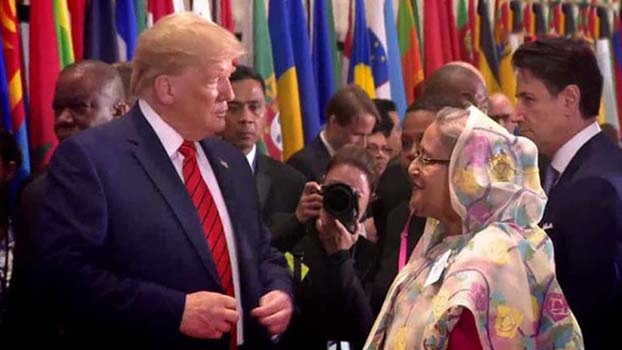 FILE PHOTO: Bangladesh Prime Minister Sheikh Hasina (right) exchanges pleasantries with former US President Donald Trump at a launch hosted by UN Secretary General António Guterres at UN Headquarters on September 25, 2019