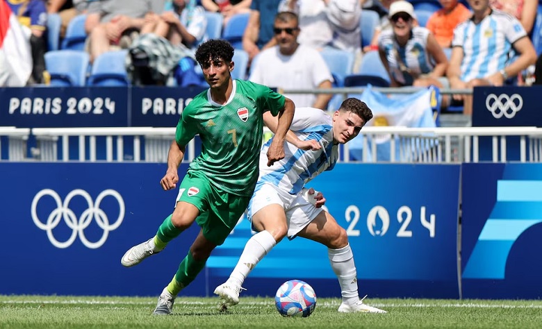 Ali Jasim of Iraq in action with Julian Alvarez of Argentina. Photo: REUTERS