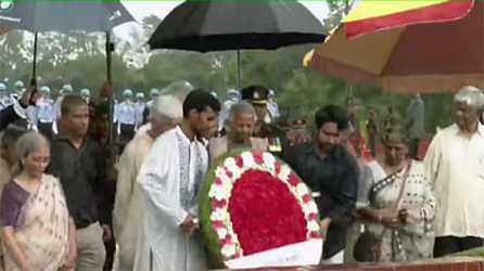 Dr Muhammad Yunus along with other members of the advisory council pays tribute to the martyrs of the Liberation War at the National Martyrs' Memorial in Savar on Friday morning. Photo: Collected