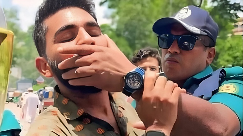 The photo shows recently suspended police inspector Arshad Hossain covering a student protester's mouth during quota reform movement near Supreme Court area on July 31. Photo: Collected