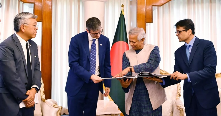 Chief Adviser Professor Muhammad Yunus shows an art book on graffiti of Bangladesh to the visiting US delegation after they met him at the State guesthouse Jamuna in Dhaka on Sunday 