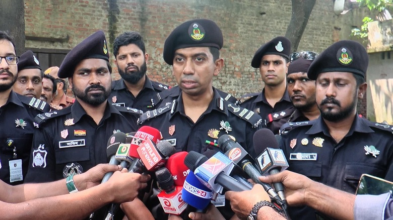 Lt Col Tanvir Mahmud speaks to reporters after visiting the sites.