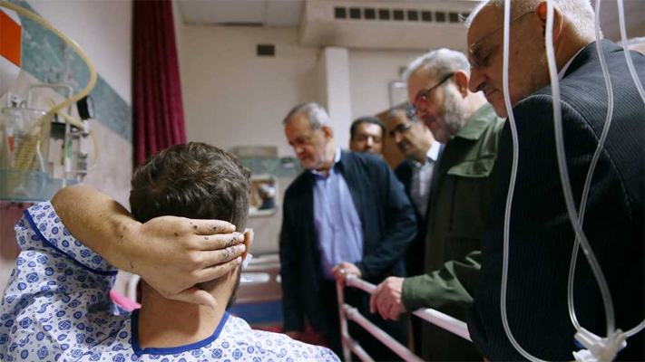 Iran's President Masoud Pezeshkian visits one of the victims injured by pager explosions across Lebanon, in a hospital in Tehran, Iran, September 20, 2024. Iran's Presidency/WANA (West Asia News Agency)/Handout via REUTERS/File Photo 