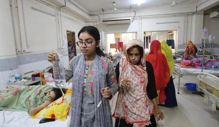 Patients infected with dengue receive treatment at a hospital in Dhaka