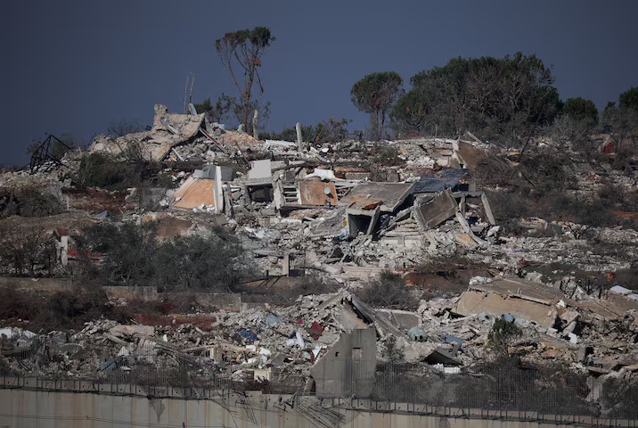 Israeli soldiers carry their belongings as they prepare for a military leave near their positions on the border with Lebanon on Dec. 3, 2024. (AFP)