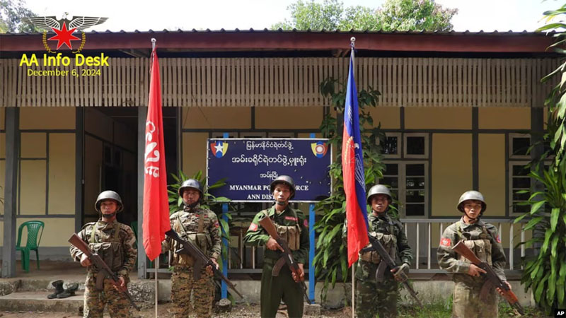 FILE - This photo released by the Arakan Army shows members of the Arakan Army posing in front of the captured district police office in Ann township, Rakhine state, Myanmar, November  29, 2024. Photo: AP