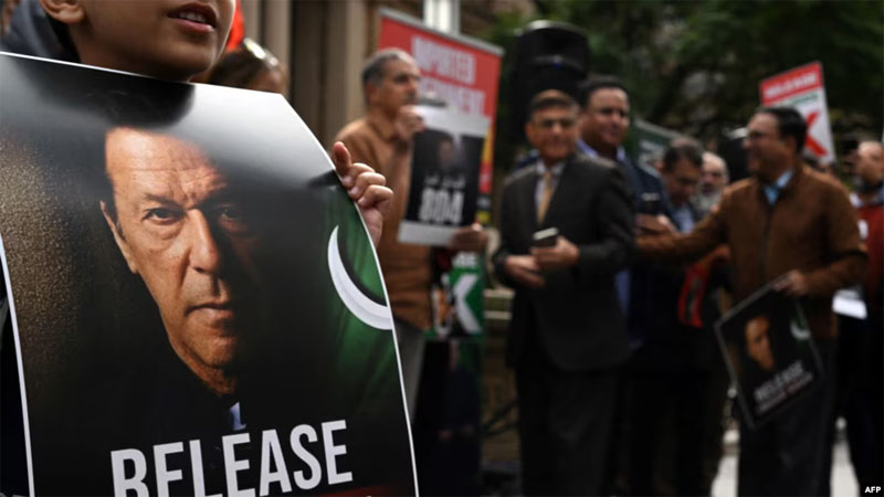 A supporter of jailed former prime minister Imran Khan holds a placard during a protest rally in Sydney on August 4, 2024, demanding Khan's release from jail. File Photo: AFP